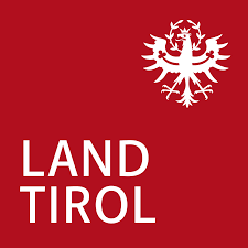 Rotes Logo des Landes Tirol mit weißer Schrift und weißem Adler rechts oben